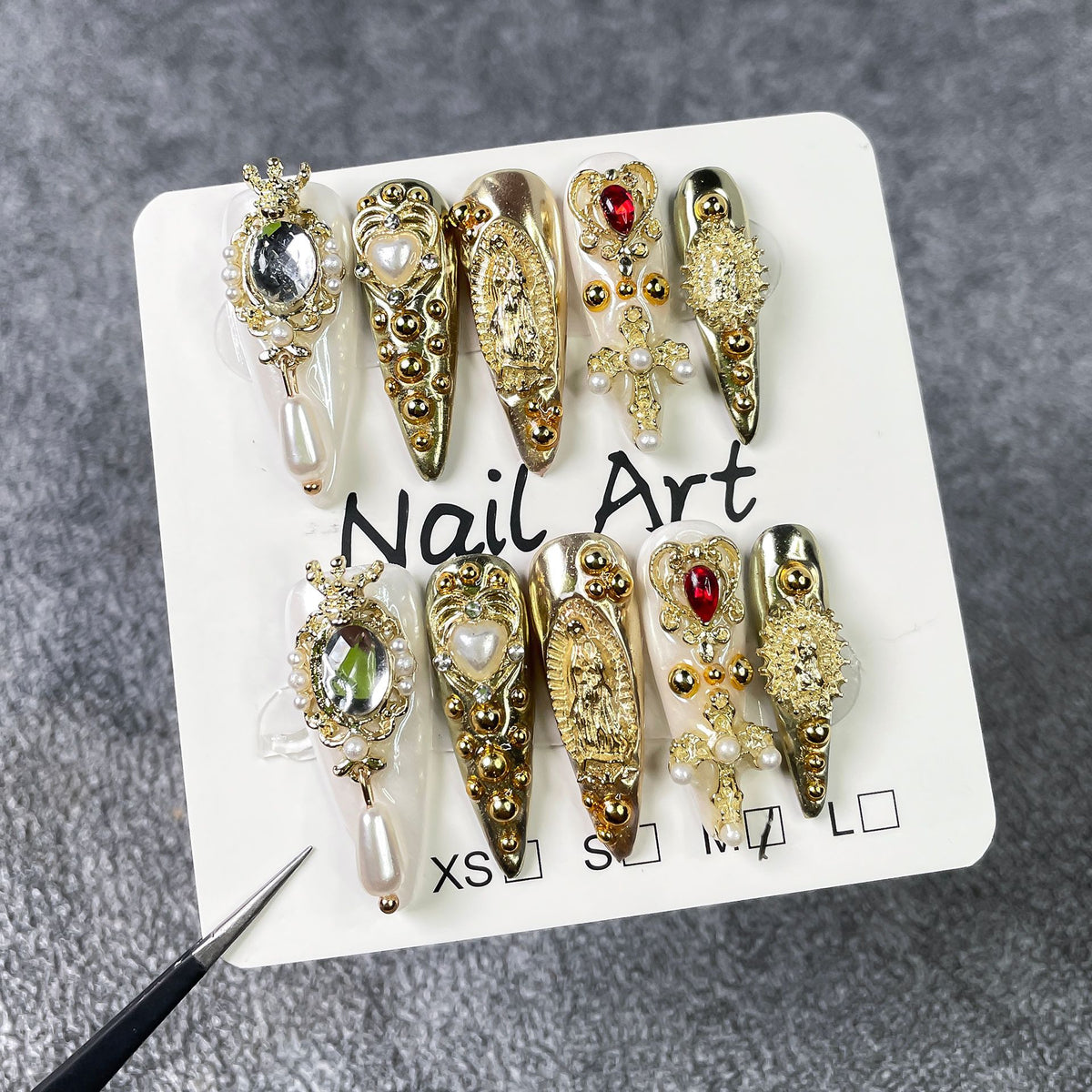 Full set of ornate gold press on nails with crystals, pearls and 3D charms