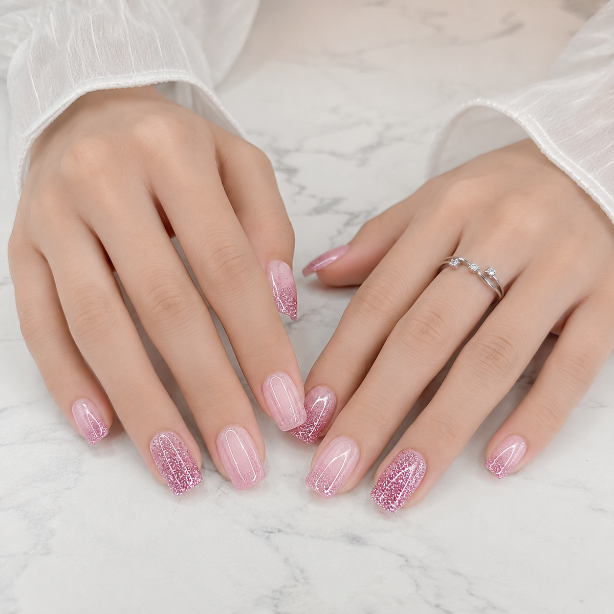 Pink Glitter Press On Nails on White Marble Background