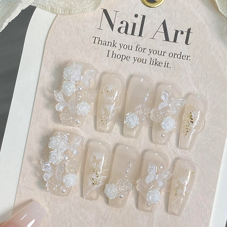 Baby blue 3D press on nail set with flowers, butterflies and pearl details