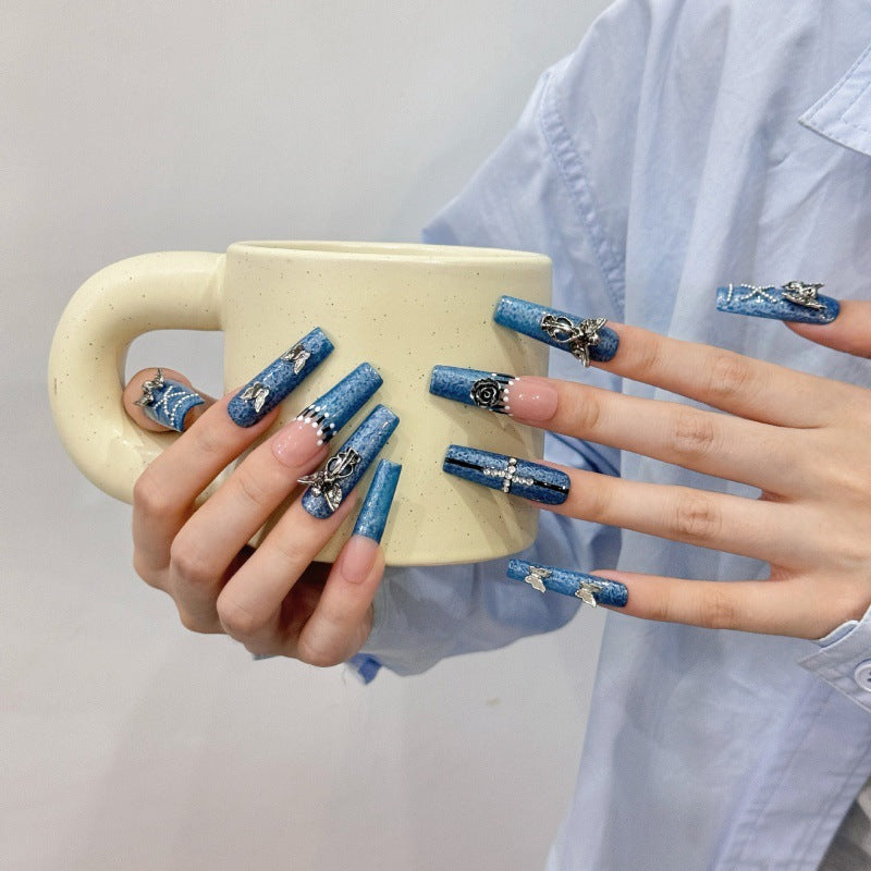 Blue Denim Press On Nails with Silver Charms Holding a Mug