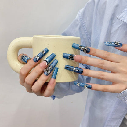 Blue Denim Press On Nails with Silver Charms Holding a Mug