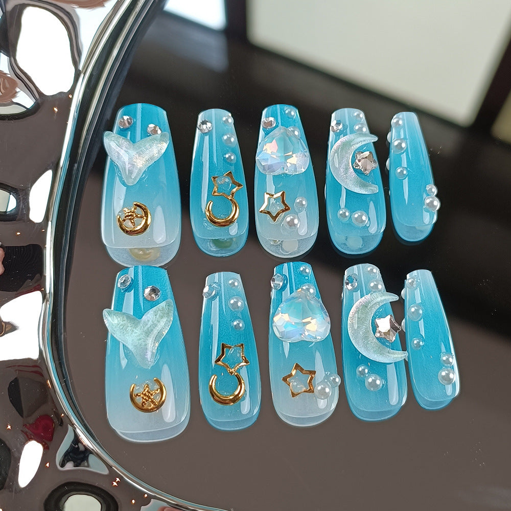 Blue celestial press on nail set with moon, star, heart and pearl decorations