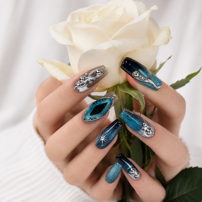 Blue teal cat eye chrome 3D press on nails holding a white rose, elegant handmade reusable luxury fake nails.