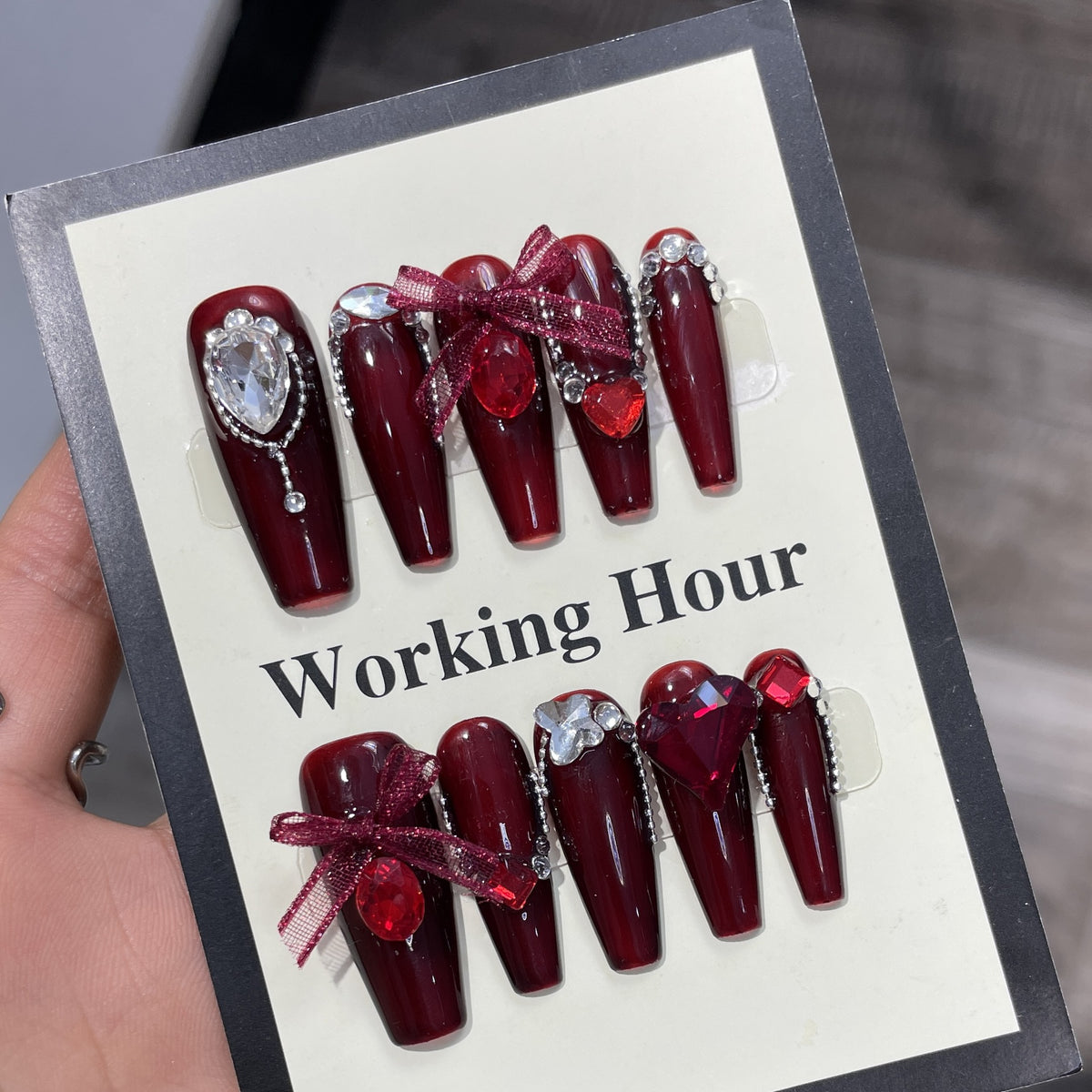 Burgundy press on nail set with red gemstones rhinestones and bow accents