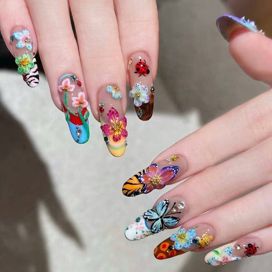 Colorful 3D press on nails with floral, butterfly and rhinestone nail art