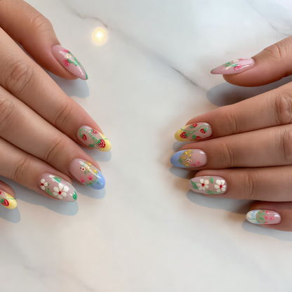 Colorful floral press on nails with strawberry design on natural hands