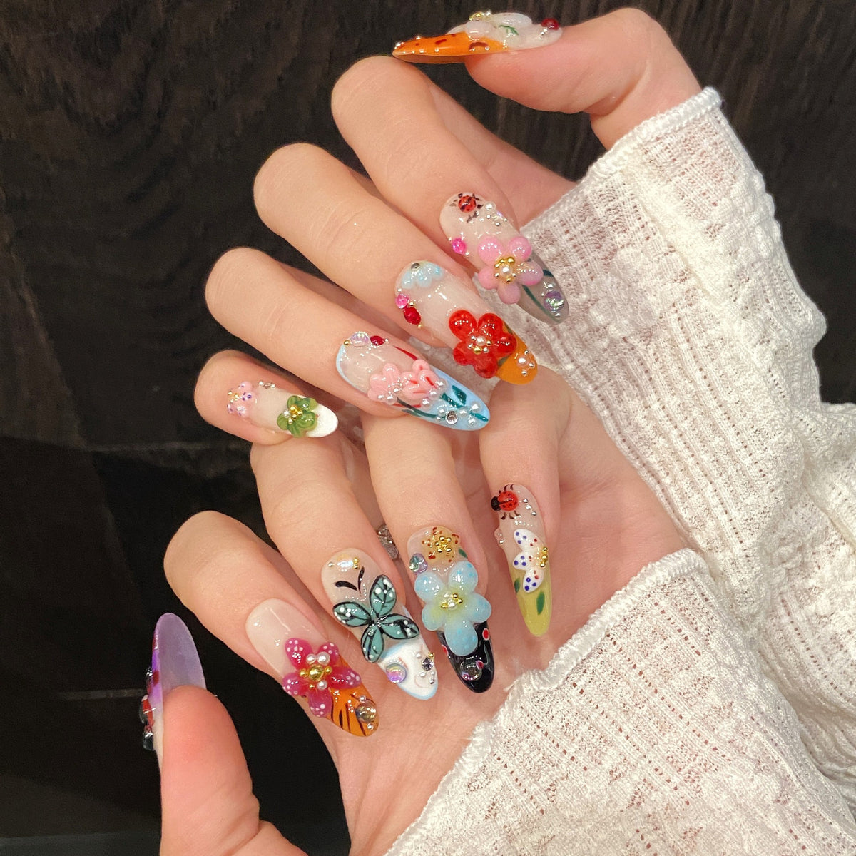 Colorful long press on nails with 3D flowers, butterflies and crystal details