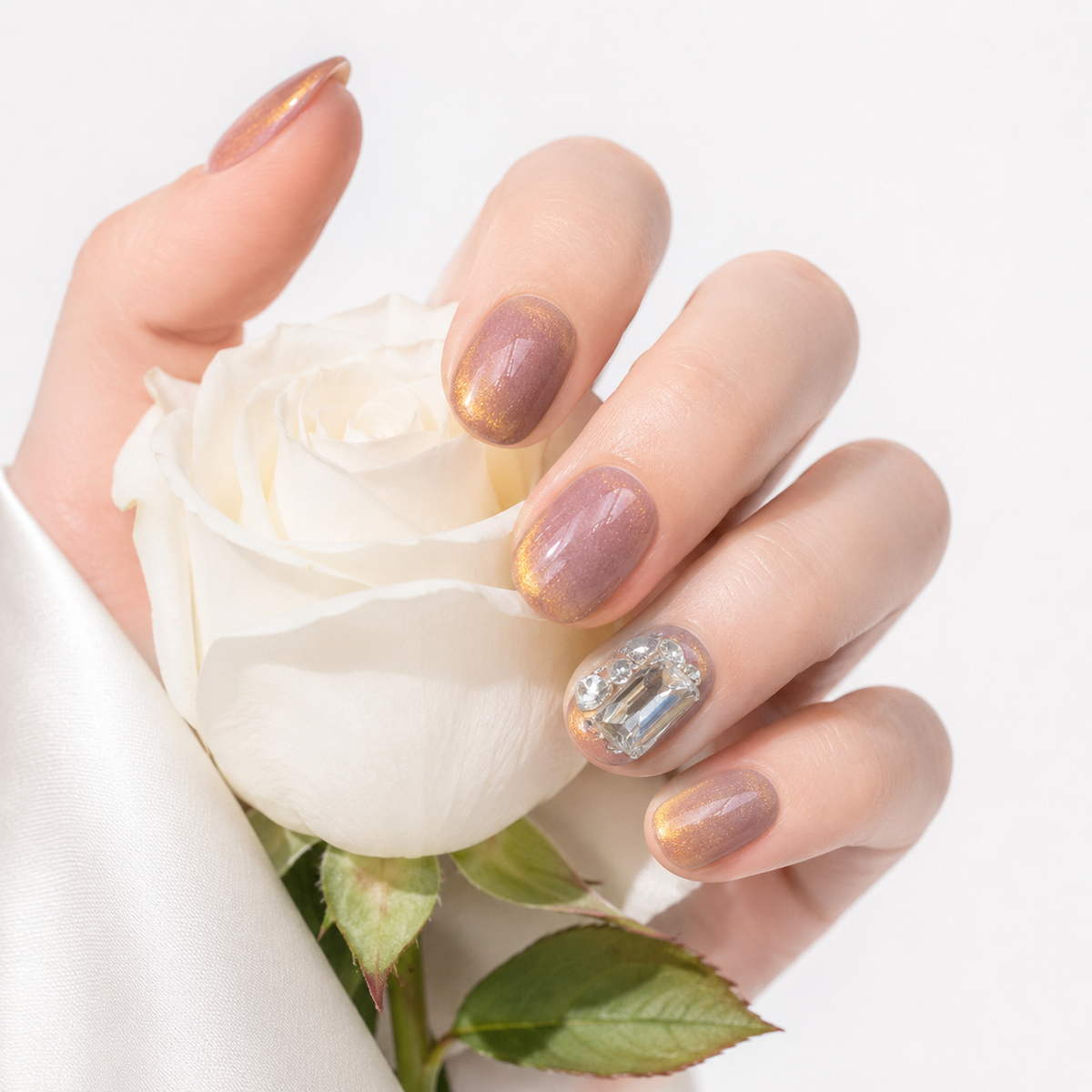 Elegant brown cat eye fake nails with crystal rhinestone accent