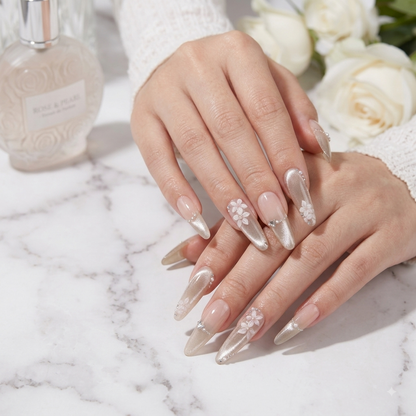 Elegant nude 3D flower press on nails displayed on both hands