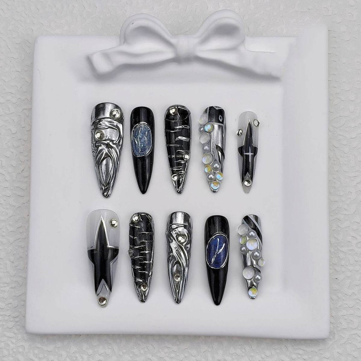 Full set of black silver gothic press on nails with chrome and blue gemstone details