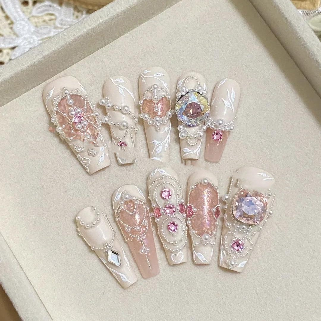 Full set of pink pearl press on nails with crystals and 3D embellishments