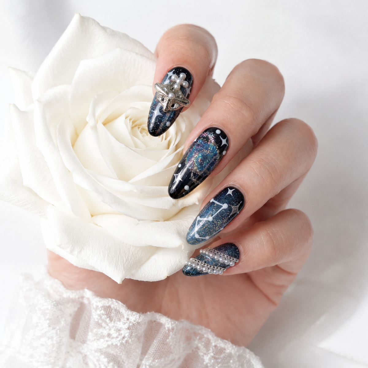 Galaxy press on nails with 3D silver star charms, pearls and celestial nail art