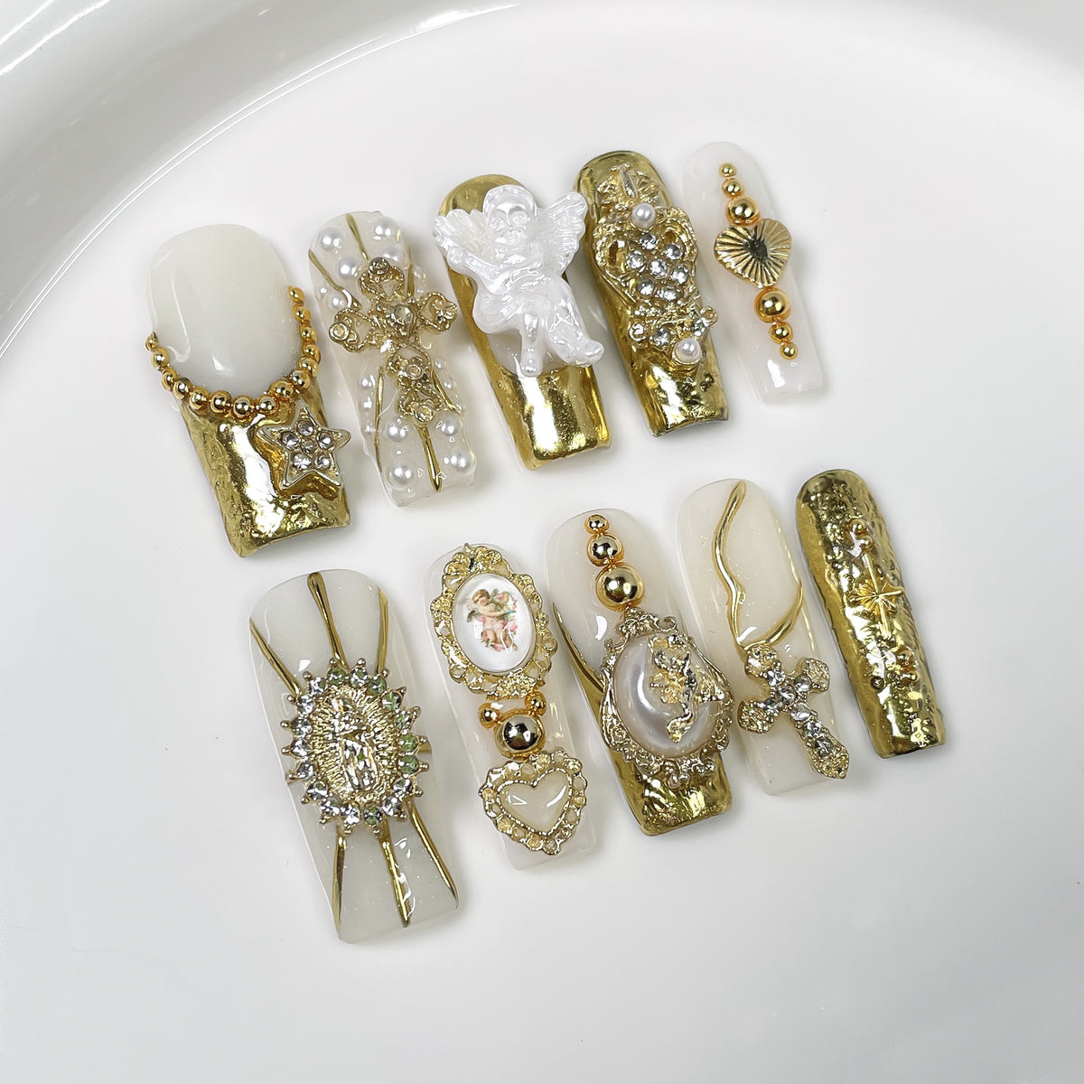 Gold and white luxury press on nails with 3D angel charms and rhinestones
