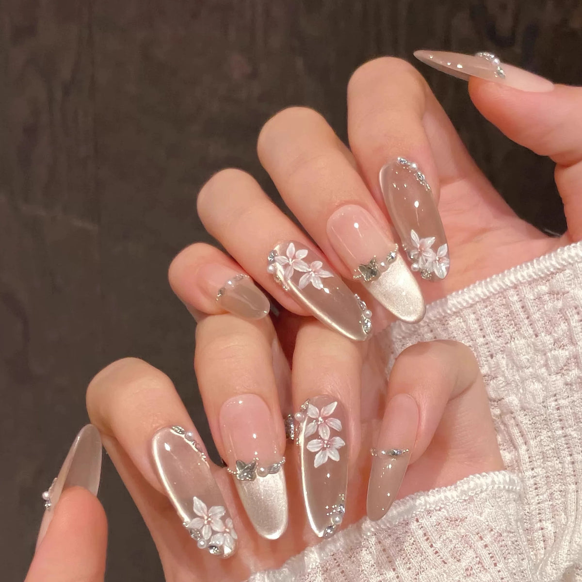 Handmade nude floral press on nails with silver chrome and rhinestone details