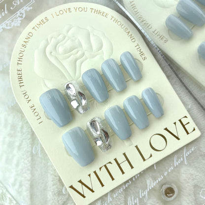 Light blue press on nails with silver 3D bow accents