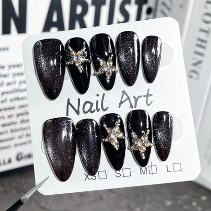 Luxury black crystal press on nails beautifully packaged, handmade reusable almond fake nails ready for gifting and special occasions.