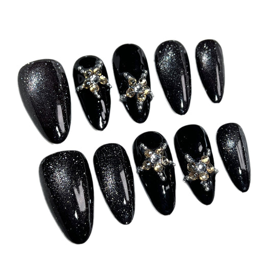 Luxury black crystal press on nails with glitter finish, handmade almond fake nails featuring sparkling rhinestone accents and reusable salon-quality design.