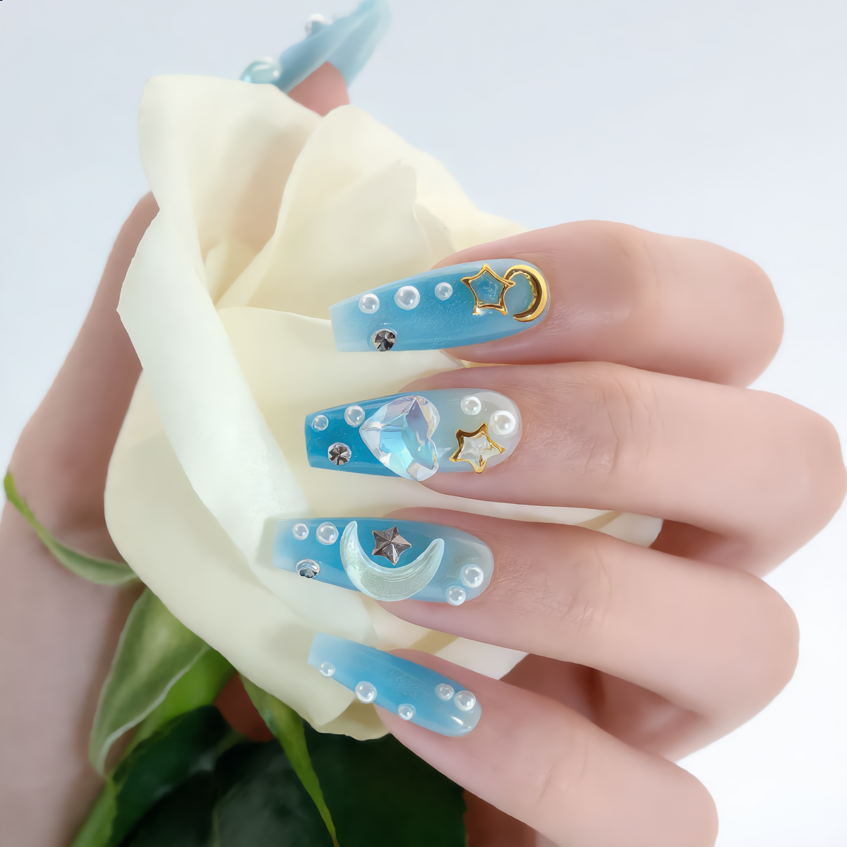 Luxury blue celestial press on nails with moon, stars, pearls and white rose