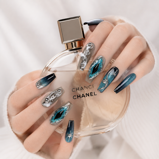 Luxury blue teal cat eye chrome press on nails holding a luxury perfume bottle, handmade reusable salon quality fake nails.