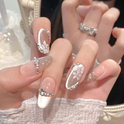 Luxury long floral press on nails with nude shimmer and silver accents