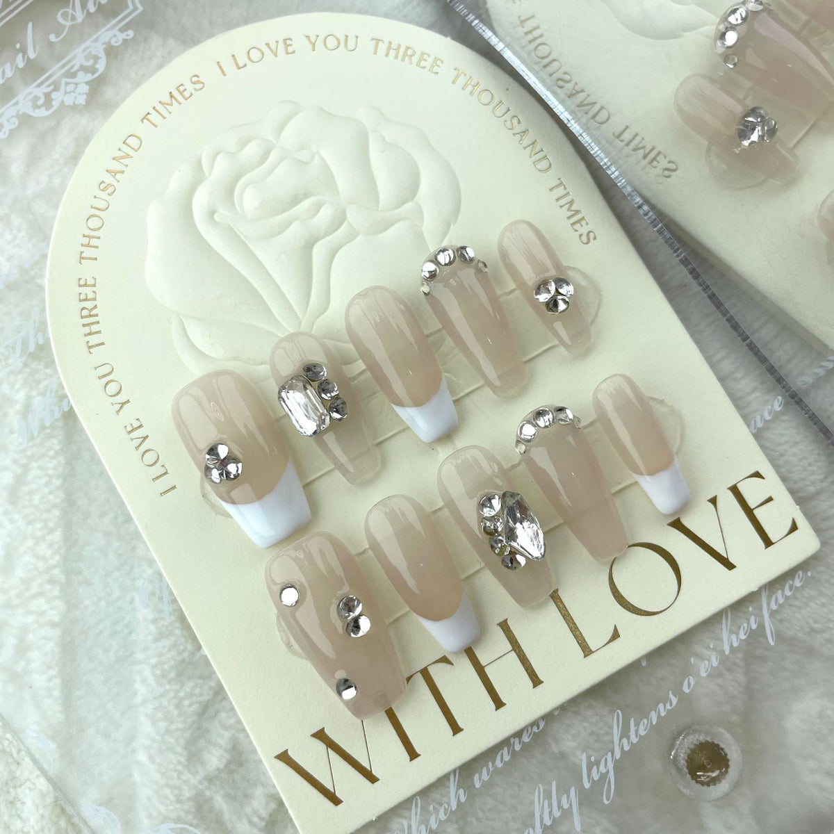 Nude crystal press on nails with iridescent heart and rhinestone accents