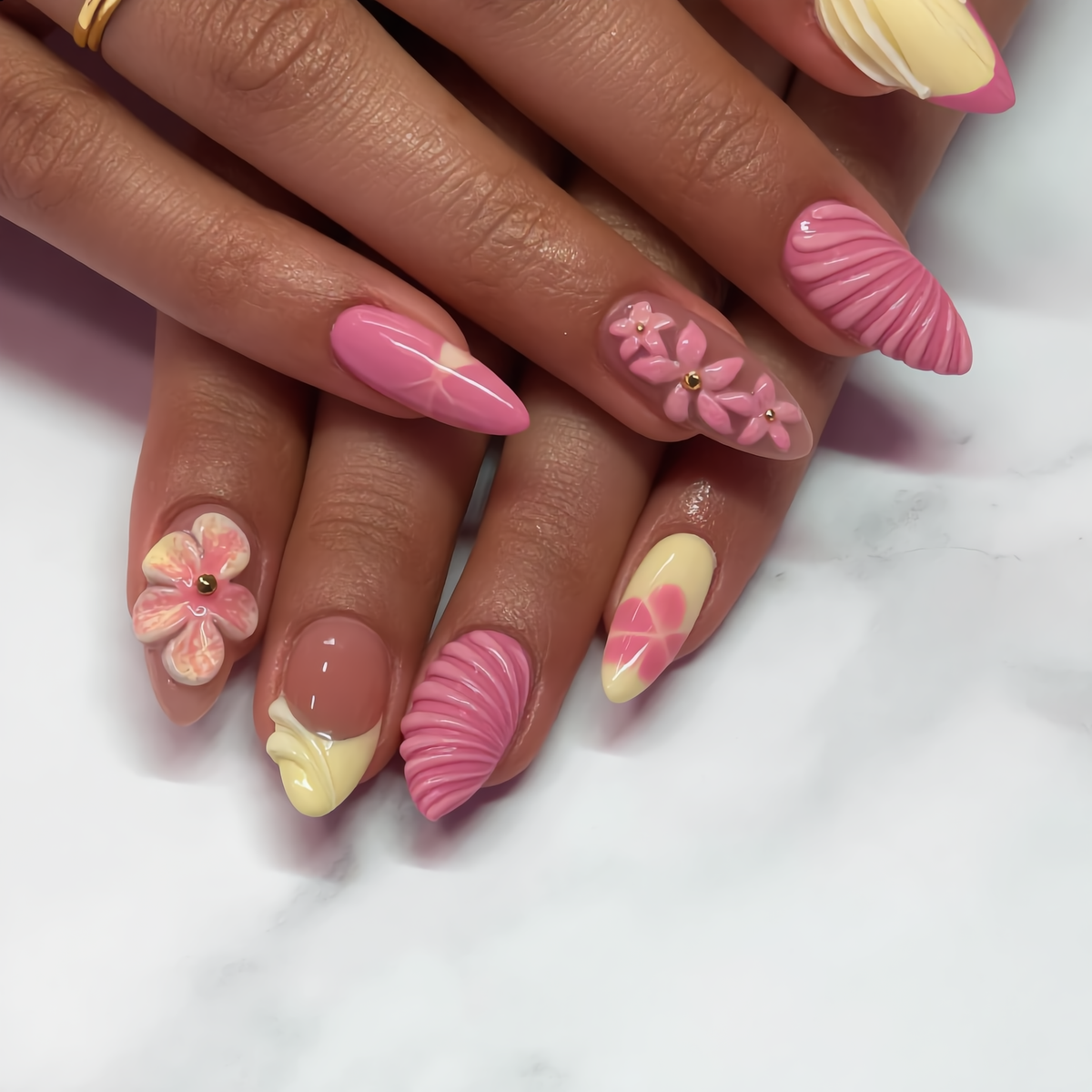 Pink and cream 3D floral press on nails displayed on both hands