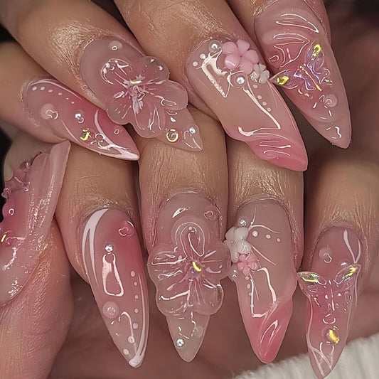 Pink floral 3D almond press on nails with handcrafted flower details, glossy finish, luxury reusable fake nails for elegant everyday wear.