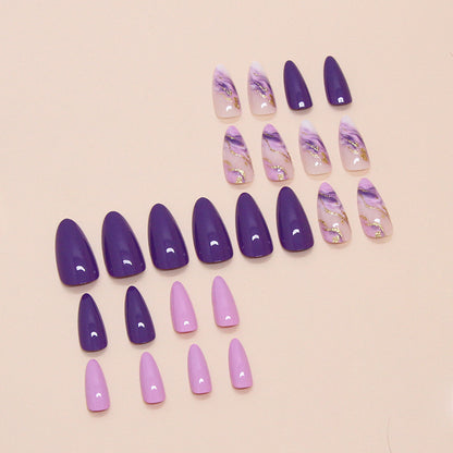 Purple marble press on nail set with gold accents and almond shape