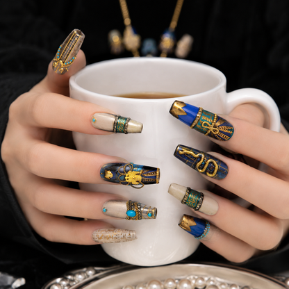 Royal Egyptian Press On Nails Holding a White Coffee Cup