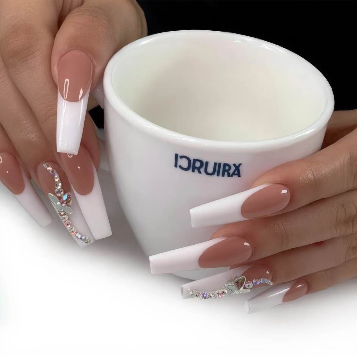 White French crystal press on nails styled with a coffee cup, luxury coffin nail set