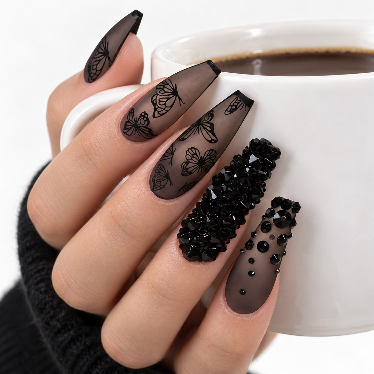Black butterfly press-on nail set with 10 handmade-style nails and black rhinestone details