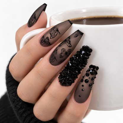Black butterfly press-on nail set with 10 handmade-style nails and black rhinestone details