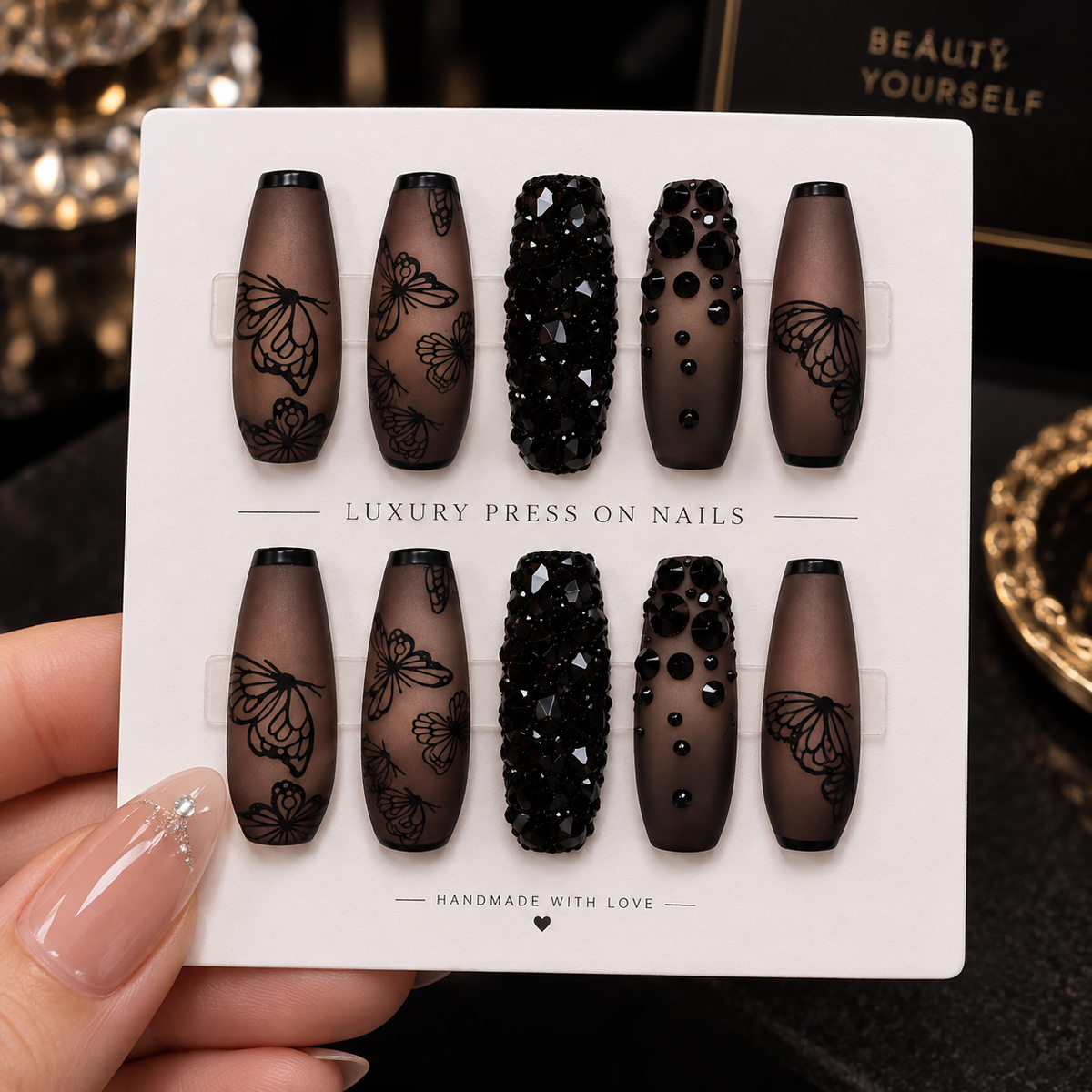 Long coffin black butterfly press-on nails with matte finish and black crystal accents