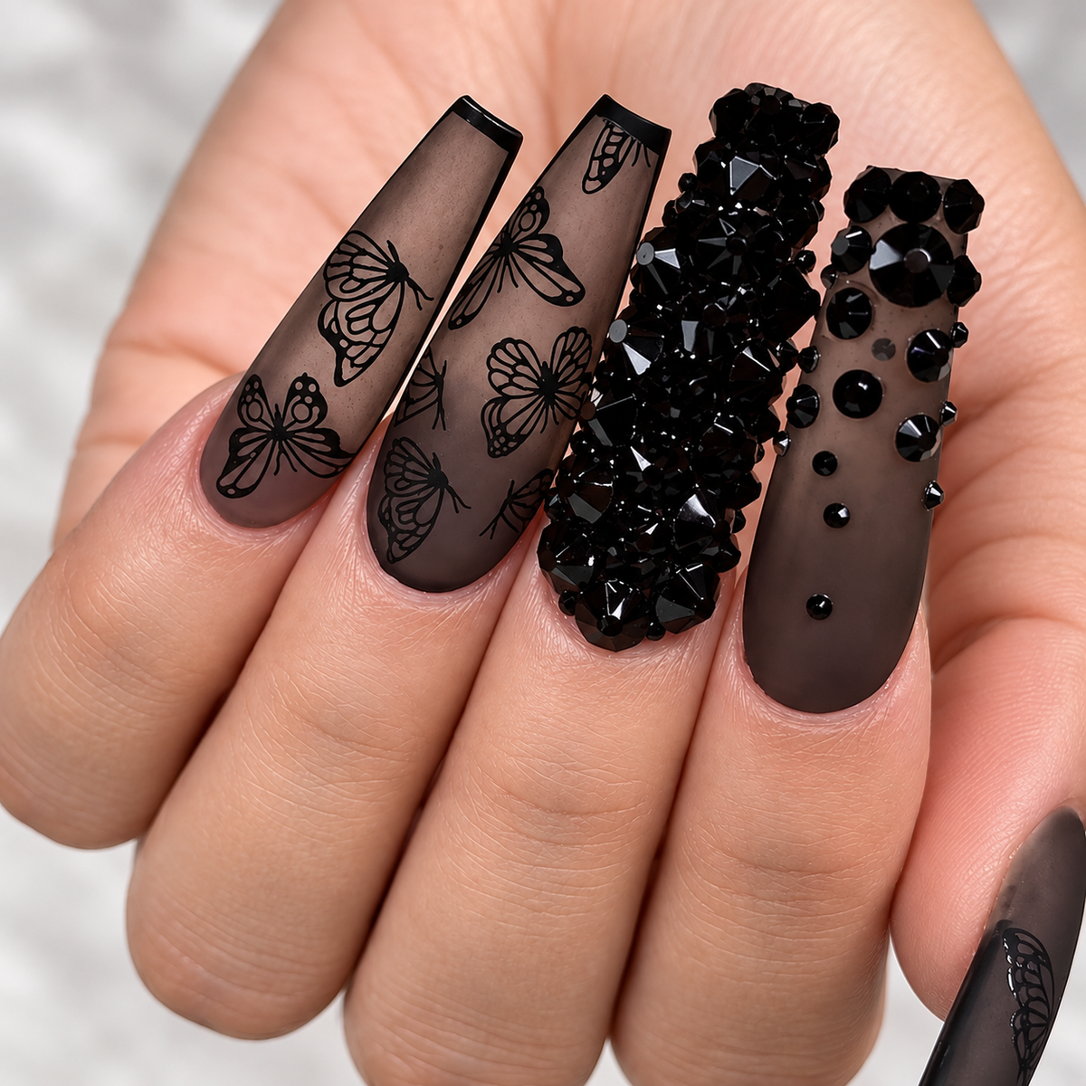 Luxury black butterfly press-on nails with black crystal rhinestones and matte smoky finish