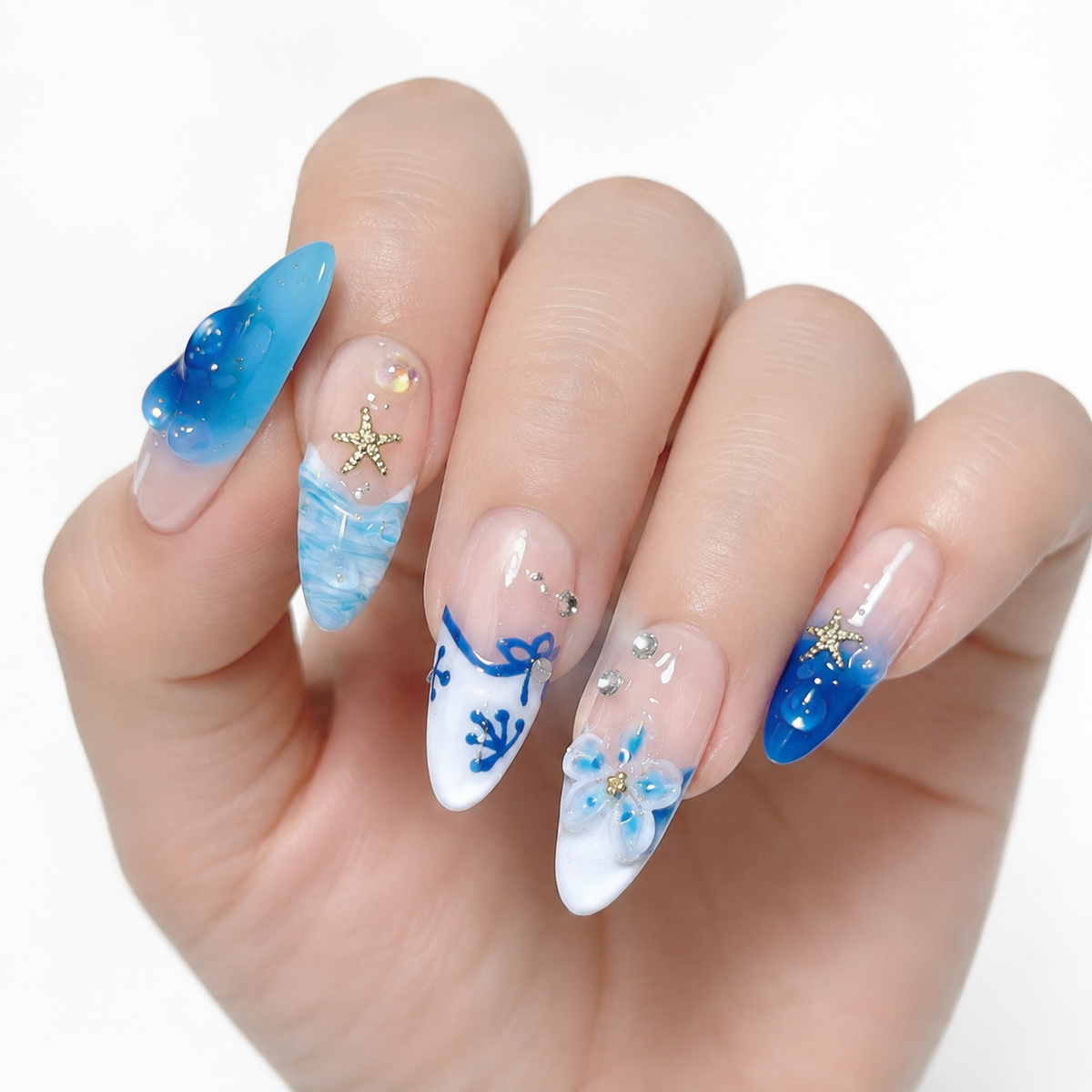 nails.jpg
Blue 3D floral press on nails with ocean wave nail art and rhinestone accents