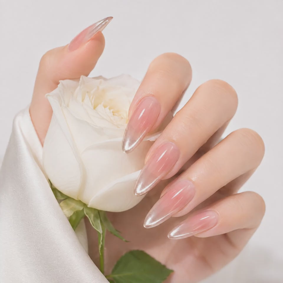 Long almond nude pink press on nails with silver chrome tips on hand