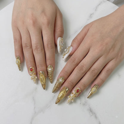 Luxury gold crystal press on nails with ornate baroque charms and rhinestones