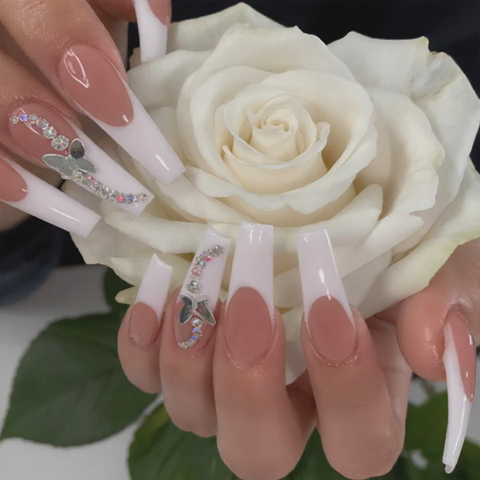 Luxury white French press on nails with 3D butterfly crystals held with a white rose