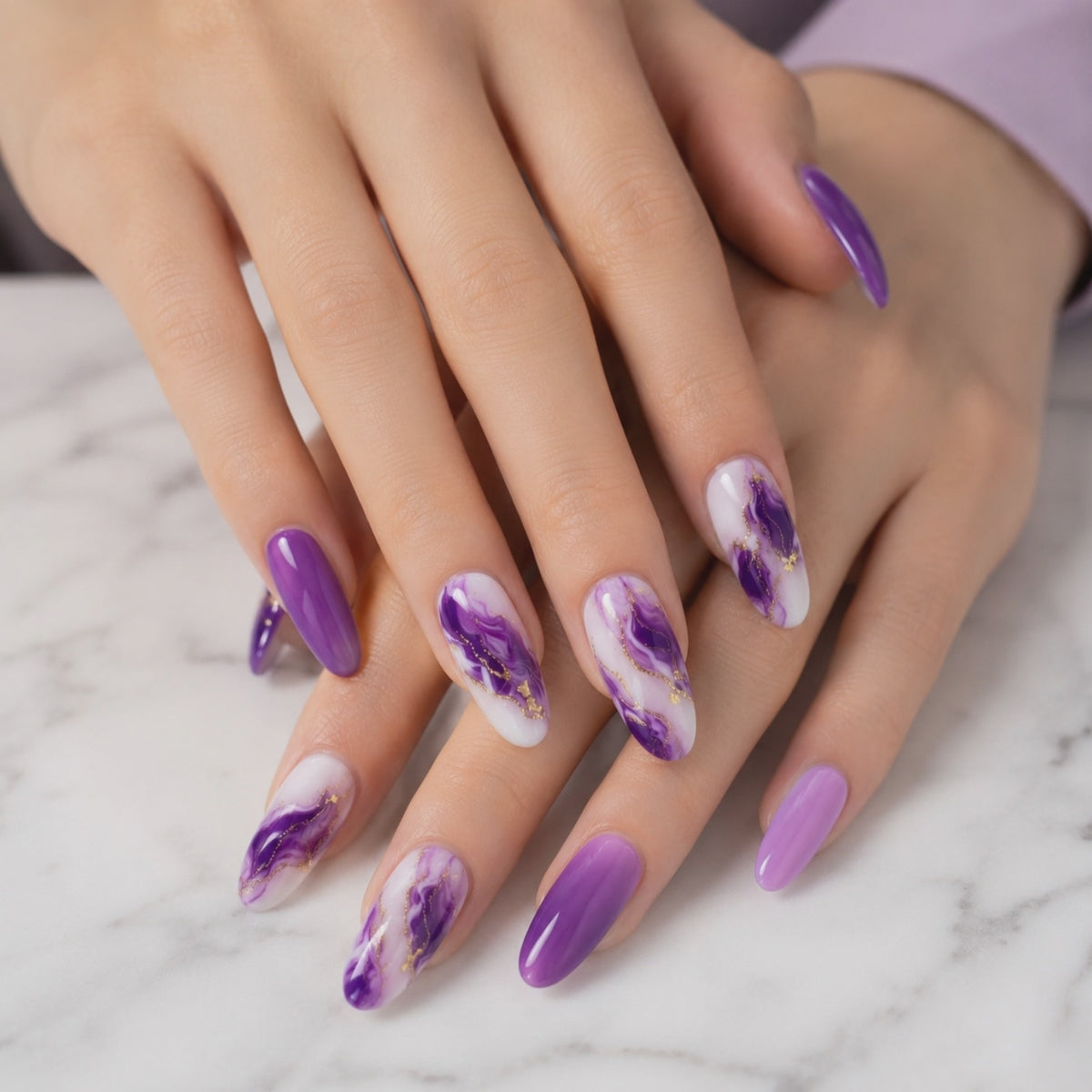 Purple almond press on nails with marble nail art and gold details