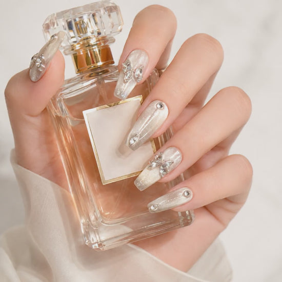 Pearl White Crystal Press On Nails Holding a White Rose