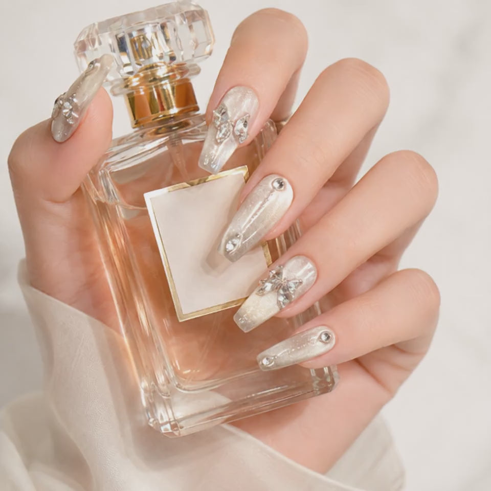 Pearl White Crystal Press On Nails Holding a White Rose