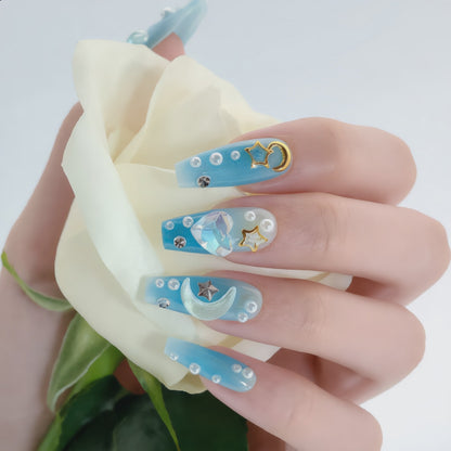 Blue celestial press on nail set with 3D charms and rhinestone details