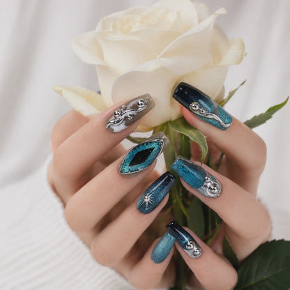 Blue teal cat eye chrome 3D handmade press on nail set with metallic silver details, reusable luxury fake nails.