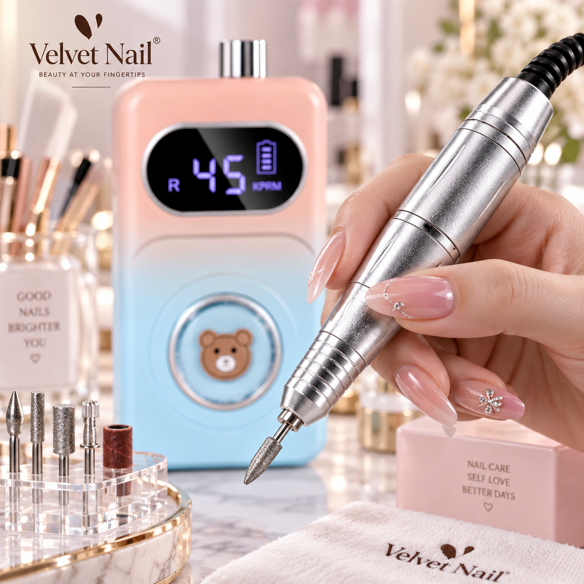 Close-up shot of a luxury silver metallic nail drill pen being held by a nail technician's hand, sharp focus on precision tip, high-performance professional nail tool.
